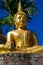 Gold Gautama Buddha statue monument