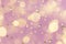 Gold gems and star confetti on a pastel pink background