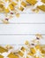 Gold gift boxes and glittering Christmas decorating items on white wood panel background, decoration item and copy space, top view