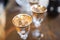 Gold glasses in the defocus on a wooden table