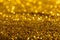 Gold glitter close-up background with shallow depth of field