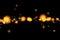 Gold glow glittering stars bokeh tail transition sparkle explosion effect on black background, holiday happy new year