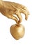 Gold hand holding apple