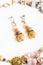 Gold handmade earrings with pink semipreciouses. nephritis and v