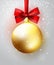 Gold hanging Christmas ball with red bow