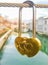 Gold heart shaped padlock hanging from string