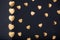 Gold hearts stickers on dark background