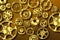 Gold industrial metal gears and sprockets background