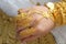 Gold jewelry on the hands of a Muslim bride.