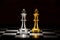 gold king chess facing silver king chess on chess board , business strategy concept