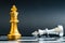 Gold king chess piece win over lying down silver team