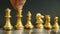Gold king is on the movement in chess game on black background Concept for business decision, first mover, start or beginning