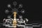 Gold king surrounded with silver chess pieces on chess board game competition with virtual digital icon