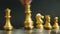 Gold kingis on the movement in chess game on black background Concept for business decision, first mover, start or beginning