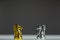 Gold knight chess and silver knight chess confront each other on transparent board. Chess knight head to head. Confrontation conce