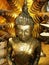 Gold leaf covered Buddha sculpture in one of the temples in Ayutthaya, former capital of the kingdom of Siam. Thailand