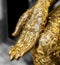 Gold leaf stick on Fingers of Buddha statue.