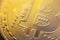 Gold light of Bitcoin currency coin extreme close-up