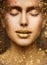 Gold Lip Gloss Make up Closeup. Beauty Model Face Portrait with Closed Eyes and Golden Sparkles on Skin. Luxury Woman Skin Care