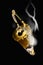 Gold Magic Lantern with Smoke Against Black background.