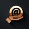 Gold Mail and e-mail in hand icon isolated on black background. Envelope symbol e-mail. Email message sign. Long shadow