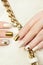 Gold manicure.