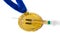 Gold medal and syringe