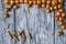 Gold nuts and gilt sticks on the background of old wooden panels, Christmas background