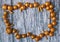 Gold nuts and gilt sticks on the background of old wooden panels, Christmas background