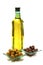 Gold olive oil in buttle over white