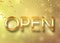 Gold open sign with confetti