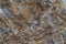 Gold ore texture close-up. Contains quartz, mica, feldspar, chlorite, garnet, carbonate, sulfides, gold
