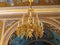 Gold ornated luxurious luster in interior of church