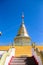 Gold pagoda on blue sky background at  phra that doi khum temple in Chiang Mai of Thailand