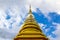 Gold pagoda pinnacle Thailand and cloudy sky background