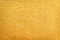 Gold paint on concrete wall in seamless rough patterns texture abstract for background