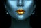 Gold paint drips from the lips, golden liquid drops on beautiful model girl`s mouth, creative abstract dark blue skin makeup