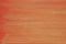 Gold painted corrugated orange paper background texture