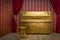 Gold painted piano with chair