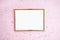 Gold photo frame, pink background with sparkles. Flat lat. Top view. Place for text