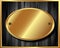 Gold plate on dark wooden background