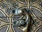 Gold-plated, antique, gothic ornament. Ancient art. Close-up