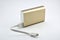Gold portable powerbank with power button and charging indicator