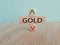 Gold price symbol. A brick block with arrow symbolizing that Gold price