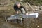 Gold researcher with his sluice in the French River Le Gardon