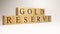 Gold reserve name was created from wooden letter cubes. Economics and finance.