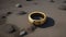 A gold ring with patterns lies on the gray, dry ground. Jewelry in the sandy desert. Generated AI.