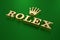 Gold Rolex logo - 3d illustration isometric view