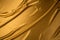 Gold Satin background textured. Soft folded cloth as background texture. Golden Clothing texture.