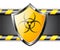 Gold shield with Biohazard sign over steel background